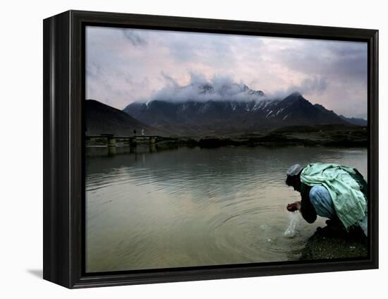 Afghan Man Washes His Face in the River before Going to Evening Prayers-null-Framed Premier Image Canvas