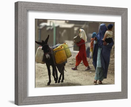 Afghan Woman Walks Along with Donkey Carrying Jerry Cans Filled with Water in Kabul, Afghanistan-null-Framed Photographic Print