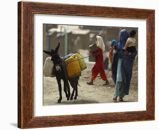 Afghan Woman Walks Along with Donkey Carrying Jerry Cans Filled with Water in Kabul, Afghanistan-null-Framed Photographic Print