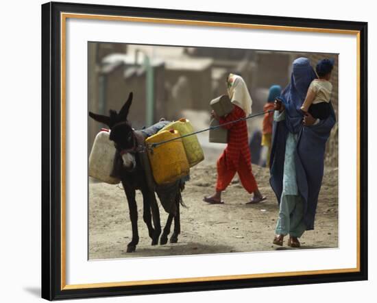 Afghan Woman Walks Along with Donkey Carrying Jerry Cans Filled with Water in Kabul, Afghanistan-null-Framed Photographic Print