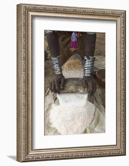 Africa, Ethiopia, Southern Omo, Karo Tribe. Woman grinding grain into flour with stone.-Ellen Goff-Framed Photographic Print