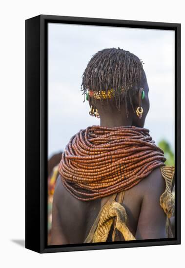 Africa, Ethiopia, Southern Omo Valley. Nyangatom woman wear heavy beads and other decorations.-Ellen Goff-Framed Premier Image Canvas
