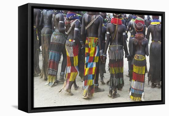 Africa, Ethiopia, Southern Omo Valley. Nyangatom women wear long leather skirts with beadwork.-Ellen Goff-Framed Premier Image Canvas