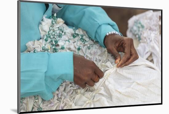 Africa, Gambia, Banjul. Close-up of Woman tying fabric for dyeing.-Alida Latham-Mounted Photographic Print