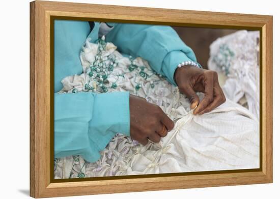 Africa, Gambia, Banjul. Close-up of Woman tying fabric for dyeing.-Alida Latham-Framed Premier Image Canvas