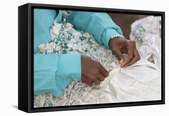 Africa, Gambia, Banjul. Close-up of Woman tying fabric for dyeing.-Alida Latham-Framed Premier Image Canvas