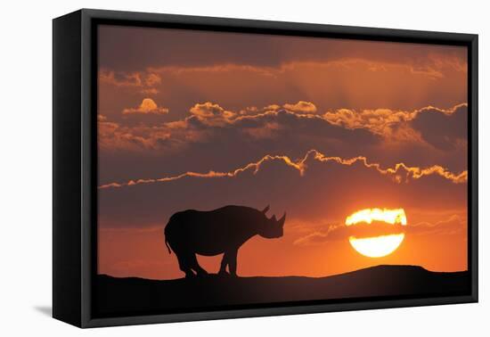 Africa, Kenya, Masai Mara Game Reserve. Composite of White Rhino Silhouette and Sunset-Jaynes Gallery-Framed Premier Image Canvas