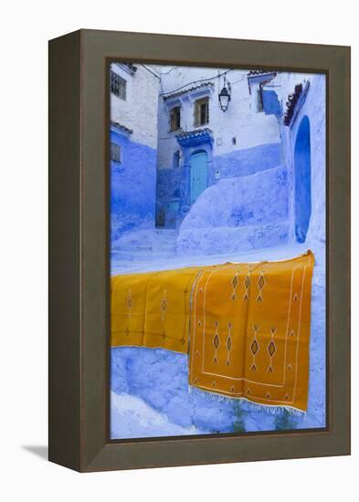 Africa, Morocco, Chefchaouen. Rugs Draped on a Wall in the Blue Town-Brenda Tharp-Framed Premier Image Canvas