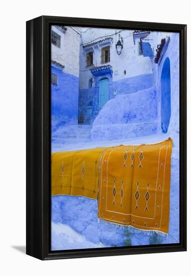 Africa, Morocco, Chefchaouen. Rugs Draped on a Wall in the Blue Town-Brenda Tharp-Framed Premier Image Canvas