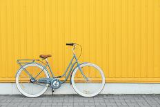 Retro Bicycle near Yellow Wall Outdoors-Africa Studio-Photographic Print