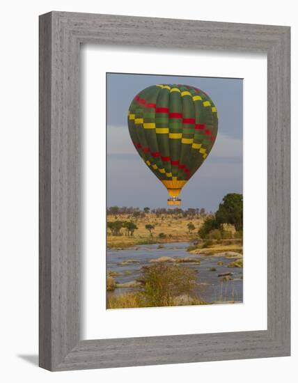 Africa. Tanzania. Hot air balloon crossing the Mara River, Serengeti National Park.-Ralph H. Bendjebar-Framed Photographic Print