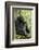 Africa, Uganda, Kibale National Park. Wild male chimpanzee sits on a log.-Kristin Mosher-Framed Photographic Print