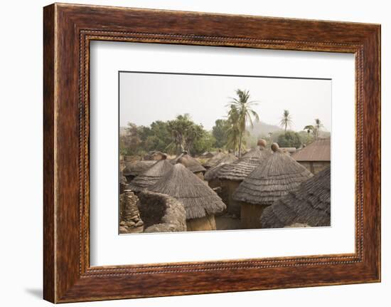 Africa, West Africa, Benin, Beri. Thatched rooves of traditional dwellings in front of palm trees.-Alida Latham-Framed Photographic Print