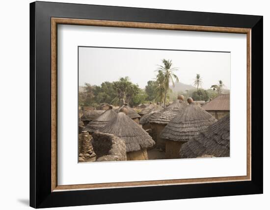 Africa, West Africa, Benin, Beri. Thatched rooves of traditional dwellings in front of palm trees.-Alida Latham-Framed Photographic Print