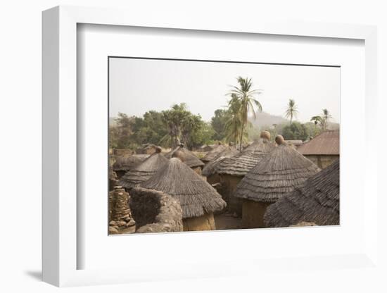 Africa, West Africa, Benin, Beri. Thatched rooves of traditional dwellings in front of palm trees.-Alida Latham-Framed Photographic Print