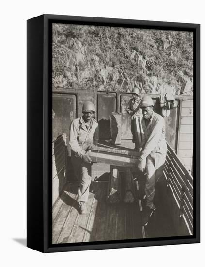 African American Ammunition Handlers Unloading Shells for the Battle of Brest in France-null-Framed Stretched Canvas