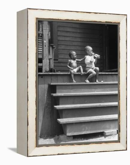 African American Boys at top of Stairs as Older Boy is Drinking Soda and Younger One Reaches for It-Alfred Eisenstaedt-Framed Premier Image Canvas
