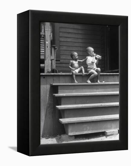 African American Boys at top of Stairs as Older Boy is Drinking Soda and Younger One Reaches for It-Alfred Eisenstaedt-Framed Premier Image Canvas