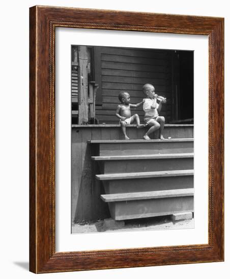 African American Boys at top of Stairs as Older Boy is Drinking Soda and Younger One Reaches for It-Alfred Eisenstaedt-Framed Photographic Print