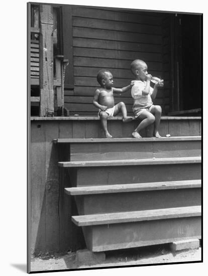 African American Boys at top of Stairs as Older Boy is Drinking Soda and Younger One Reaches for It-Alfred Eisenstaedt-Mounted Photographic Print