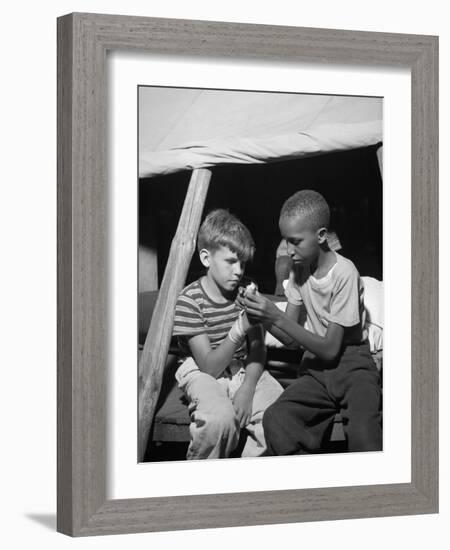 African American Camper Helps a White Bubby with His Bandaged Hand-Gordon Parks-Framed Photo