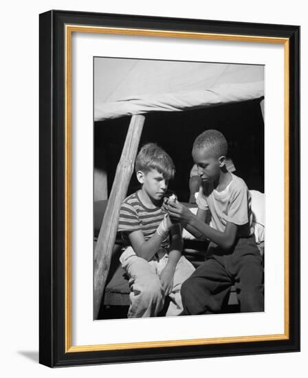 African American Camper Helps a White Bubby with His Bandaged Hand-Gordon Parks-Framed Photo