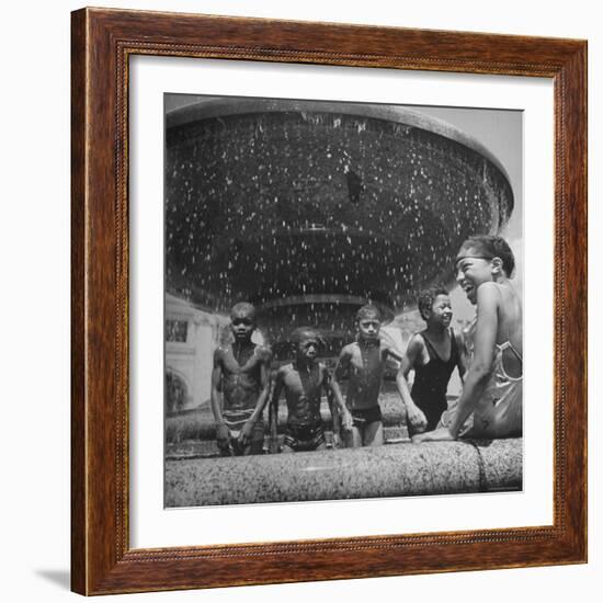 African American Children Playing in a Fountain-Marie Hansen-Framed Photographic Print