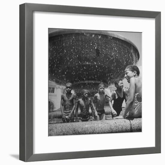 African American Children Playing in a Fountain-Marie Hansen-Framed Photographic Print