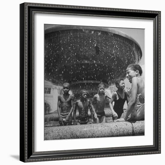 African American Children Playing in a Fountain-Marie Hansen-Framed Photographic Print