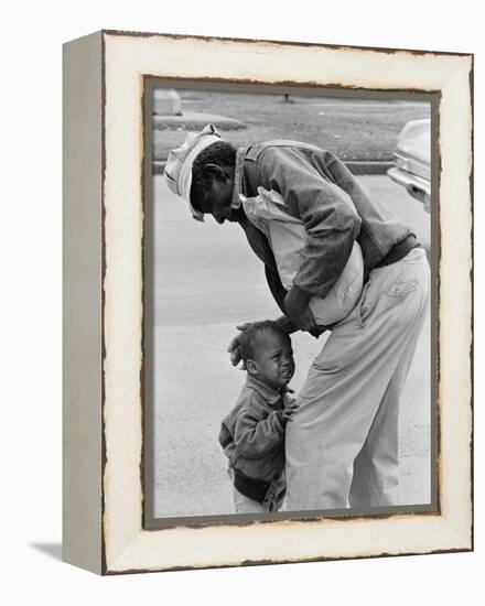 African American Man Comforts Crying Child Photograph-Lantern Press-Framed Stretched Canvas