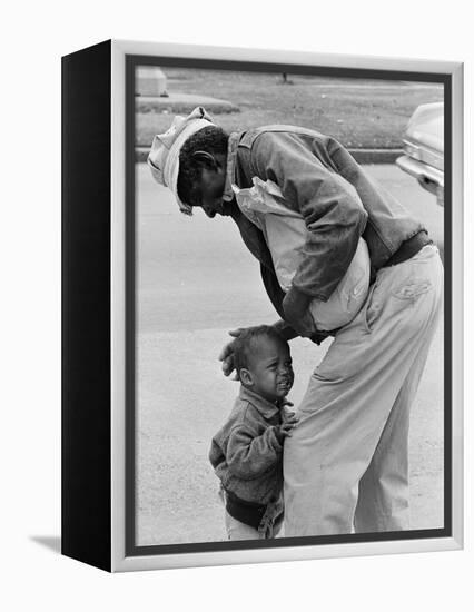 African American Man Comforts Crying Child Photograph-Lantern Press-Framed Stretched Canvas