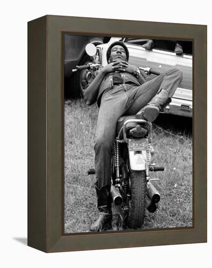 African American Man Relaxing on His Motocycle During Motorcycle Races near Detroit, Michigan-John Shearer-Framed Premier Image Canvas