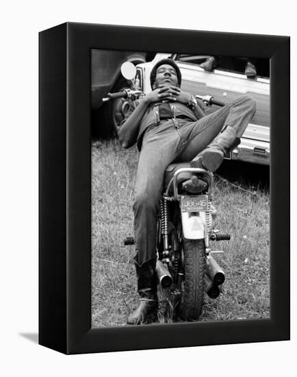 African American Man Relaxing on His Motocycle During Motorcycle Races near Detroit, Michigan-John Shearer-Framed Premier Image Canvas