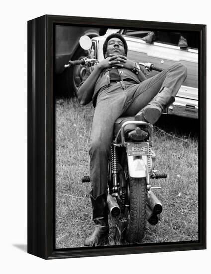 African American Man Relaxing on His Motocycle During Motorcycle Races near Detroit, Michigan-John Shearer-Framed Premier Image Canvas