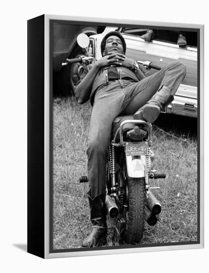 African American Man Relaxing on His Motocycle During Motorcycle Races near Detroit, Michigan-John Shearer-Framed Premier Image Canvas