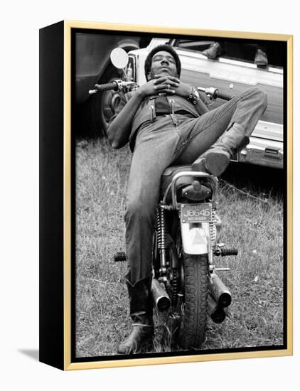 African American Man Relaxing on His Motocycle During Motorcycle Races near Detroit, Michigan-John Shearer-Framed Premier Image Canvas