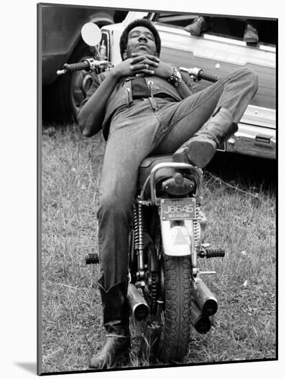 African American Man Relaxing on His Motocycle During Motorcycle Races near Detroit, Michigan-John Shearer-Mounted Photographic Print