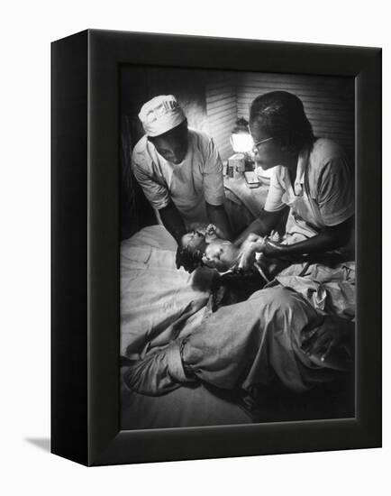 African American Midwife Maude Callen Delivering a Baby-W^ Eugene Smith-Framed Premier Image Canvas