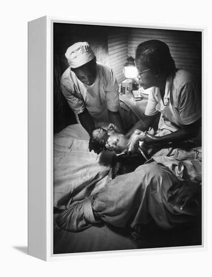 African American Midwife Maude Callen Delivering a Baby-W^ Eugene Smith-Framed Premier Image Canvas