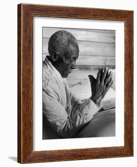 African American Sharecropper Dave Alexander Saying Evening Prayers as He Kneels at Bedside at Home-Alfred Eisenstaedt-Framed Photographic Print