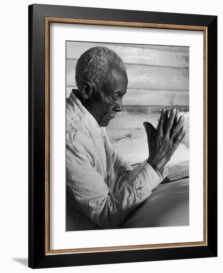 African American Sharecropper Dave Alexander Saying Evening Prayers as He Kneels at Bedside at Home-Alfred Eisenstaedt-Framed Photographic Print