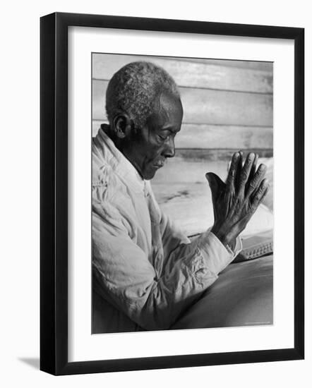 African American Sharecropper Dave Alexander Saying Evening Prayers as He Kneels at Bedside at Home-Alfred Eisenstaedt-Framed Photographic Print