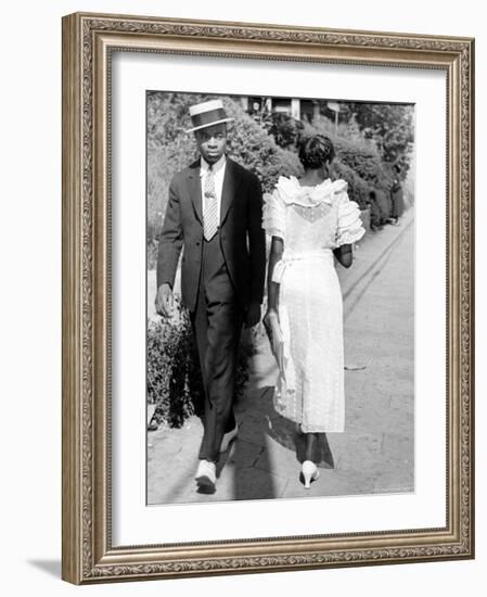 African American Sporting His Sunday Finery Glancing at Frilly Frocked Girl Passing Him on Street-Alfred Eisenstaedt-Framed Photographic Print