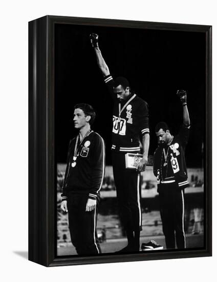 African American Track Star Tommie Smith, John Carlos After Winning Gold and Bronze Olympic Medal-John Dominis-Framed Premier Image Canvas