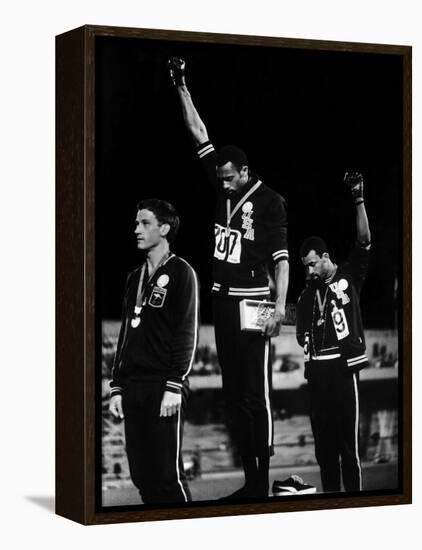 African American Track Star Tommie Smith, John Carlos After Winning Gold and Bronze Olympic Medal-John Dominis-Framed Premier Image Canvas