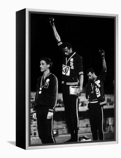 African American Track Star Tommie Smith, John Carlos After Winning Gold and Bronze Olympic Medal-John Dominis-Framed Premier Image Canvas