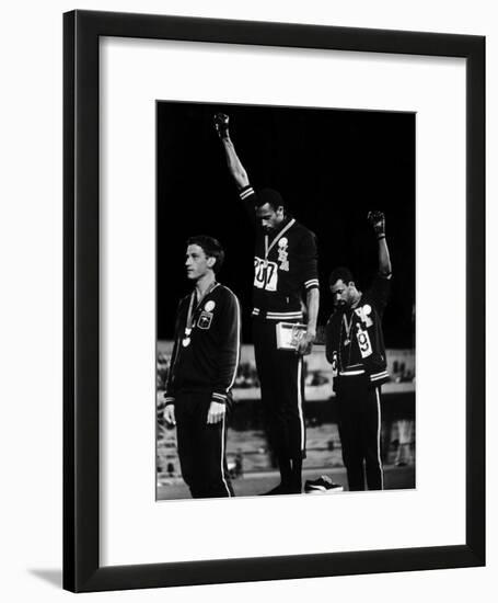 African American Track Star Tommie Smith, John Carlos After Winning Gold and Bronze Olympic Medal-John Dominis-Framed Premium Photographic Print