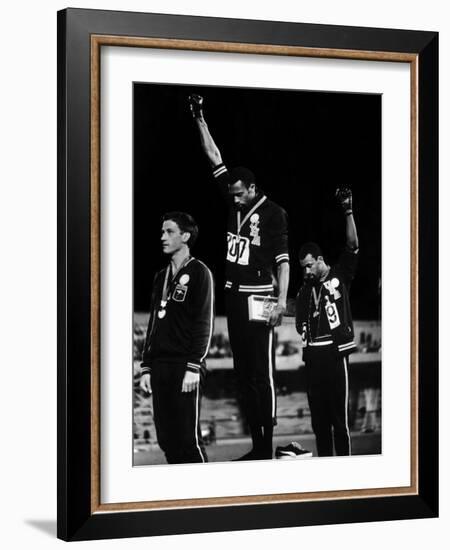 African American Track Star Tommie Smith, John Carlos After Winning Gold and Bronze Olympic Medal-John Dominis-Framed Premium Photographic Print