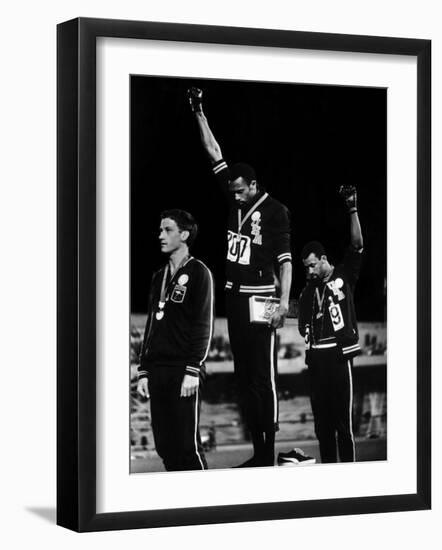 African American Track Star Tommie Smith, John Carlos After Winning Gold and Bronze Olympic Medal-John Dominis-Framed Premium Photographic Print