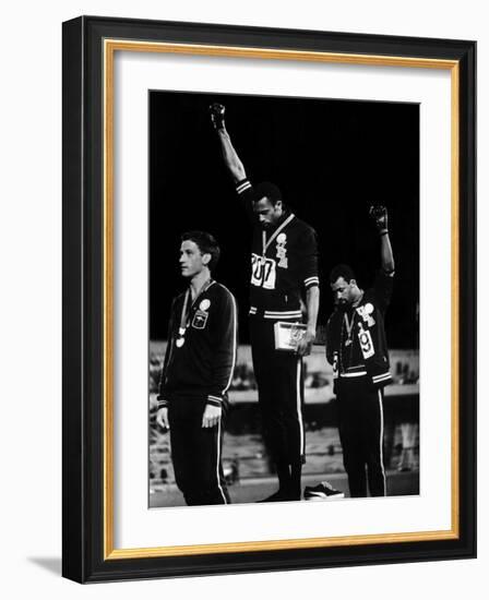 African American Track Star Tommie Smith, John Carlos After Winning Gold and Bronze Olympic Medal-John Dominis-Framed Premium Photographic Print